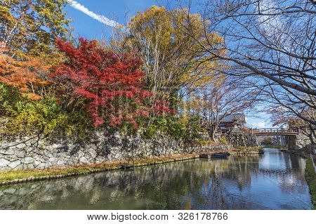 Idyllic Landscape Of Hachiman-bori Canal In Omihachiman, Japan In Autumn Season