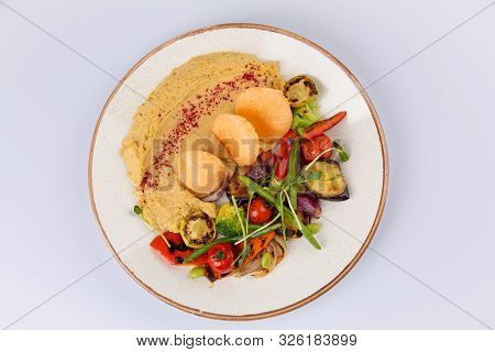 Kyufta Or Barbecue With Snacks Grilled Vegetables, Chips And Hummus.