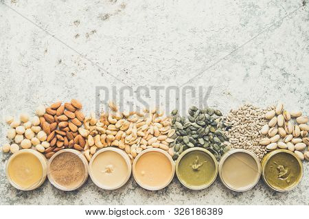 Nuts And Seeds Butter In Jars With Ingredients. Homemade Raw Organic Peanut, Almond, Hazlenut, Cashe