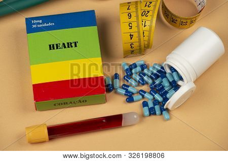 Fake Medicine Box With The Name Of The Disease Heart And A Glucometer
