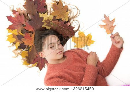 Child Enjoy Fall Season. Girl Cute Kid Long Hair Lay On White Background With Fallen Leaves. Dry Map