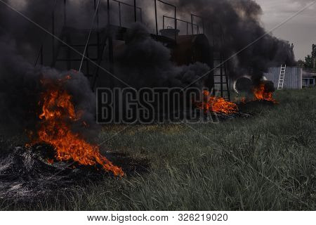 Intense Flames From A Massive Forest Fire. Flames Light Up The Night As They Rage Thru Pine Forests 