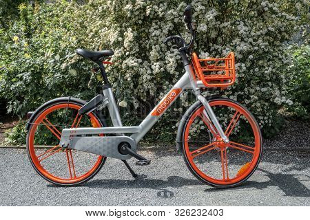 Berlin, Germany - May 17, 2019: Mobike bicycle on a street Berlin. Mobike was created by Beijing Mobike Technology Co., Ltd.