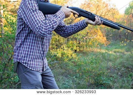 Male With Semi-automatic Shotgun In The Autumn Forest Ready To Hunting, Close Up View