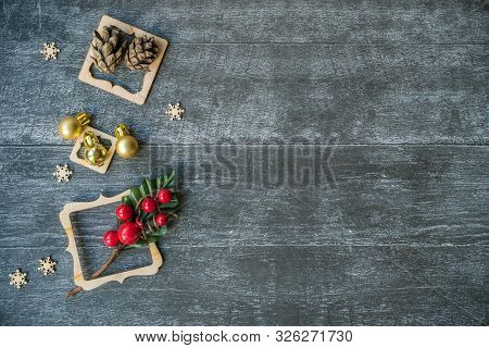 Christmas Background With Decorative Composition Of Wooden Frame, Pine Cone And Snowflakes On Wooden