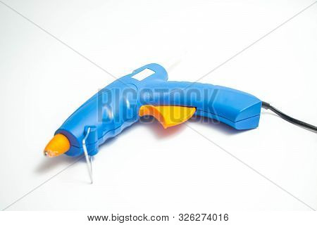 Hot Glue Gun Blue And Orange Close Up And Isolated On White Hand