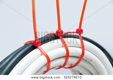 White Cable Wire With Red Zip Tie Ties