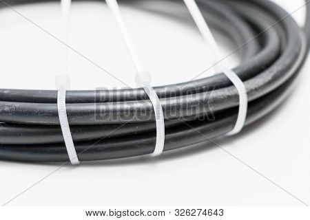 Black Wire Cable With White Zip Tie Self Lock