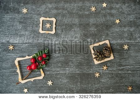 Christmas Background With Decorative Composition Of Wooden Frame, Pine Cone And Snowflakes On Wooden