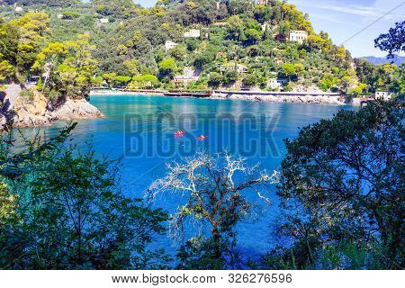 The Sand Beach Known As Paraggi Near Portofino In Genoa On A Blue Sky And Sea Background