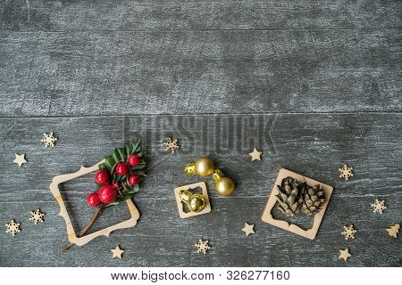 Christmas Background With Decorative Composition Of Wooden Frame, Pine Cone And Snowflakes On Wooden