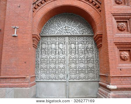 Old Red Brick Building With Sectile Gate