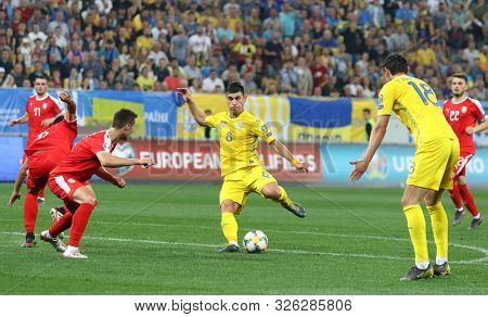 Lviv, Ukraine - June 7, 2019: Roman Yaremchuk Of Ukraine (in Yellow) Kicks A Ball During The Uefa Eu