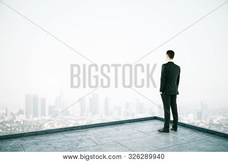 Attractive Businessman On Rooftop