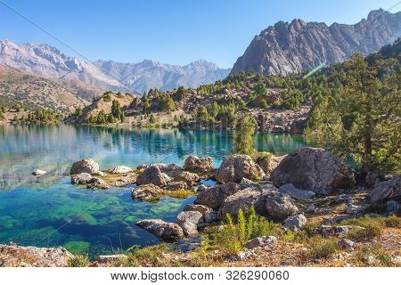 Beautiful Mountain Nature Landscape On Sunny Day. Alaudin Lake In Fann Mountains, Tajikistan. Scenic