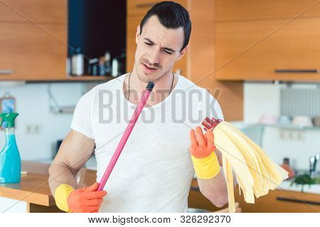 Man is a bit overwhelmed by the duties of a homemaker not knowing what to do