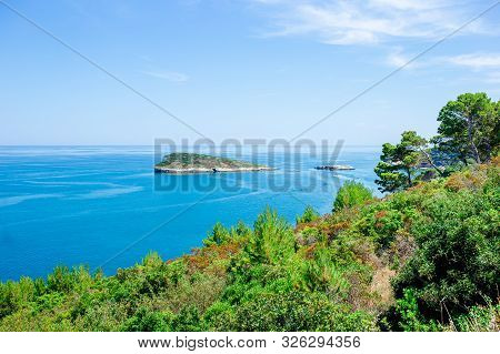 Beautiful Cozy Bay With Boats And Clear Turquoise Water In Italy