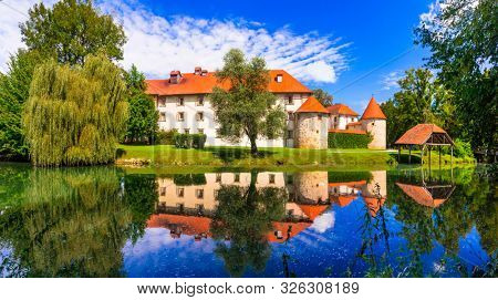 Beautiful romantic castle on the island medieval Grad Otocec in Krka river, Slovenia
