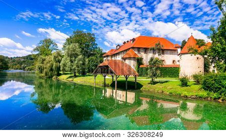 Wonderful romantic castle on the island medieval Grad Otocec in Krka river. Slovenia
