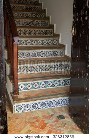 Traditional Moroccan stairs decorated with tiles in Asilah, Morocco