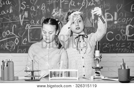 Little Kids Learning Chemistry. Chemistry Equipment. Students Do Biology Experiments With Microscope