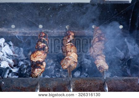 Skewers On Skewers.roasted Meat Cooked At Barbecue.bbq Fresh Beef Meat Chop Slices. Traditional East