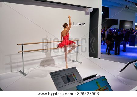 COLOGNE, GERMANY - CIRCA SEPTEMBER, 2018: model posing at Panasonic stand at the Photokina Exhibition. Photokina is a leading trade fair for the worldwide photo industry.