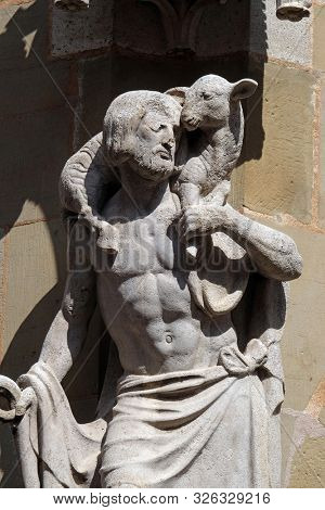 ROTHENBURG, GERMANY - JULY 16, 2019: Jesus the Good Shepherd, statue on facade of the St James Church in Rothenburg ob der Tauber, Germany