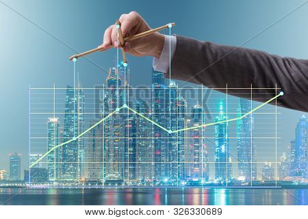 Businessman controlling the market with strings
