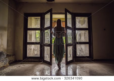 Woman Tourist In Abandoned And Mysterious Hotel In Bedugul. Indonesia, Bali Island. Bali Travel Conc