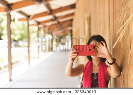 woman take a selfie at the corridor at the station