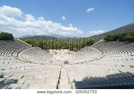 Epidaurus Greece - July 19 2019; Ancient Epidaurus Theatre Stone Seating Rows With Modern Numbers Ad