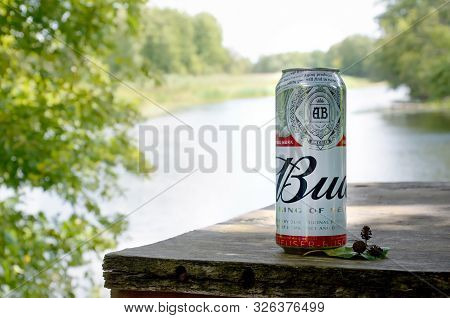 Sumy, Ukraine - August 10, 2019: Budweiser Bud Beer Can On Old Wooden Table Outdoors At The River An