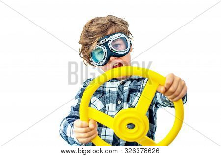 The Boy Portrays A Crazy Driver With Pilot Glasses And A Wheel In His Hands. An Emotional Teenager I