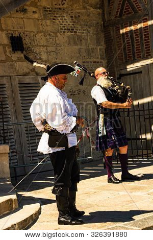 Local Artists Playing Traditional Music For Tourists On The Streets Of Honfleur, France, 2019