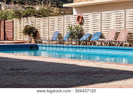 Small Rectangular Pool With Loungers In A Hotel In Stalis Crete