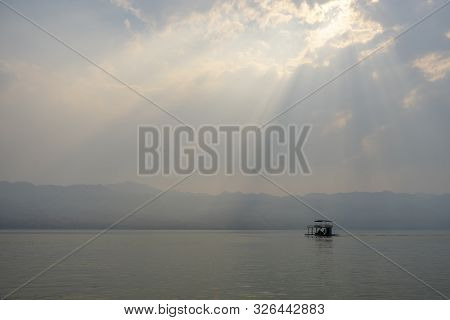 Raft In The Lake With Sunset Or Sunrise