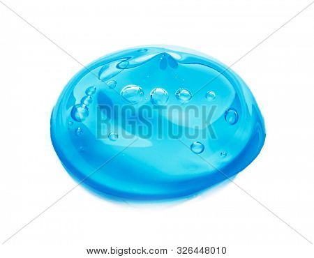 Squeezed cosmetic clear cream gel texture Iisolated on white background. Close up photo of transparent drop of skin care product. High Quality transparent gel with bubbles closeup on white background