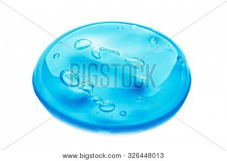 Squeezed cosmetic clear cream gel texture Iisolated on white background. Close up photo of transparent drop of skin care product. High Quality transparent gel with bubbles closeup on white background