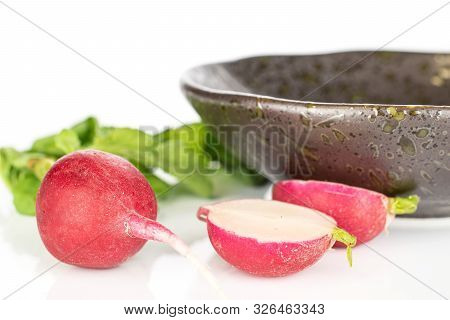 Group Of One Whole Two Halves Of Fresh Red Radish With Glazed Bowl Isolated On White Background