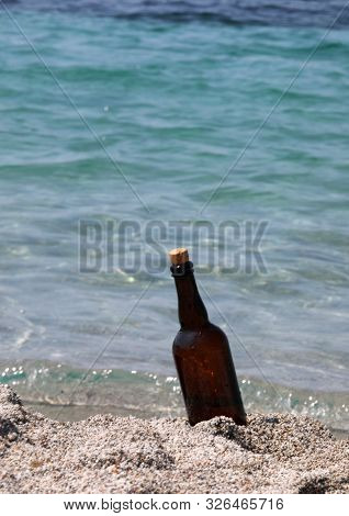 Bottle On The Sand By The Sea Perhaps With A Secret Map