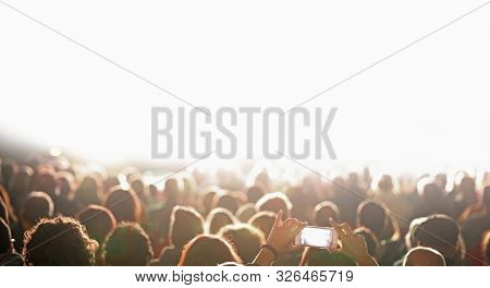 Many Heads Of Fan At Concert And White Customizable Space On The Stage