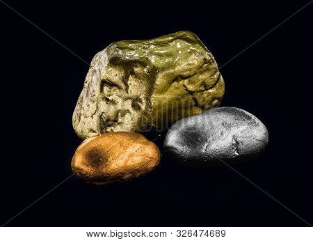 Group Of Precious Stone Gold Silver Bronze On Black Background