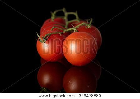 Lot Of Whole Fresh Red Tomato Isolated On Black Glass