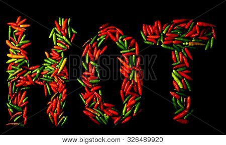 Group Of Chili Pepper Shape Hot English Words  At Black Background