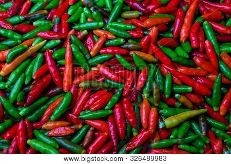 Group Of Red Hot Chili Pepper At Black Background