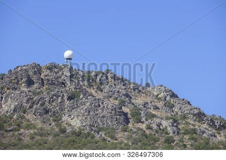 Meteorological Radar Station On The Top Of Sierra De Fuentes, Spain, Spa Area. Blue Sky Background