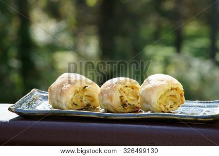 Overhead View Of Homemade Spicy Potato Filled Puff Pastry Or Pattice.
