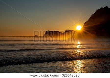 Dramatic Sunrise At Dawn In Tolaga Bay New Zealand
