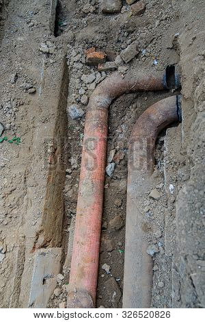 Old Leaky Pipes In The Pit. Preparation For Pipe Replacement.